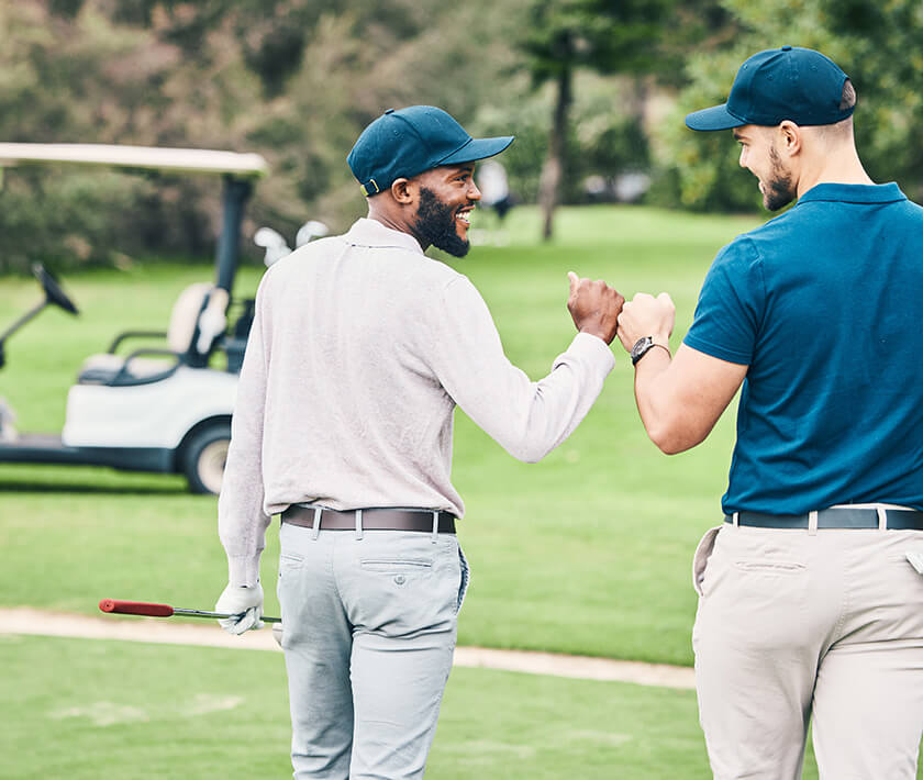 golfers fist bumping