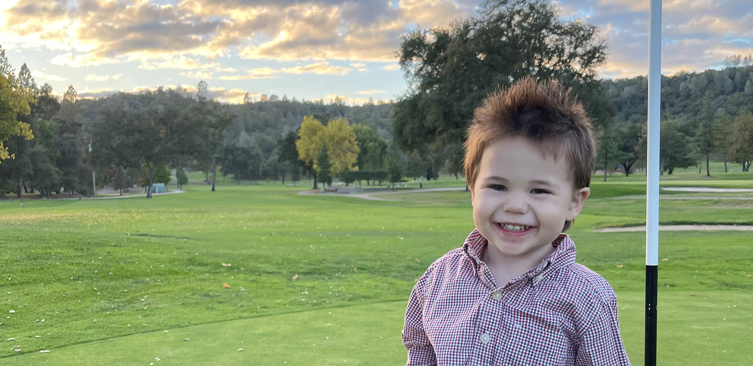 young boy on golf green